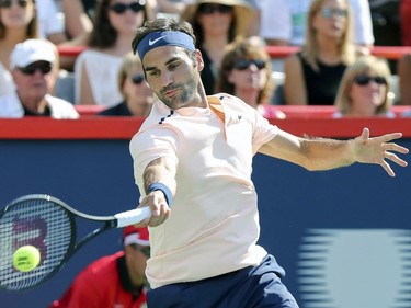 Roger Federer hits a forehand return during the championship match against Alexander Zverev at the Rogers Cup tennis tournament at Uniprix Stadium in Montreal on Sunday, August 13, 2017.