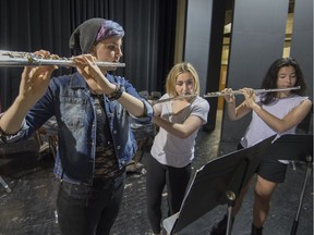 Ashley Murphy left, Veronica Jaramillo, middle and Belinda Chung practice for their week of performances at two Metro stations.