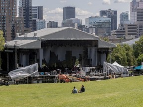 Workers set up a  stage on Mount Royal Wednesday, Aug. 16, 2017, for Saturday's free concert as part of Montreal's 375th celebrations.