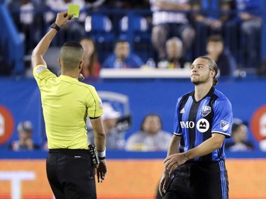 Montreal Impact's Samuel Piette reacts to being given a yellow card by the referee during second half of MLS action against the Chicago Fire in Montreal on Wednesday August 16, 2017.