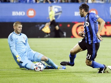 Chicago Fire goalkeeper Matt Lampson makes a save on a shot by Montreal Impact's Matteo Mancosu during first half of MLS action in Montreal on Wednesday August 16, 2017.