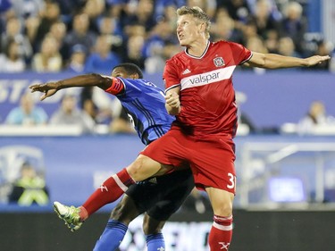 Chicago Fire's Bastian Schweinsteiger, right, collides with Montreal Impact's Patrice Bernier during second half of MLS action in Montreal on Wednesday August 16, 2017.