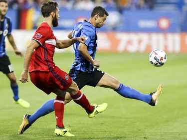 Montreal Impact's Blerim Dzemaili, right, tries to block pass by Chicago Fire's Jonathan Campbell during first half of MLS action in Montreal on Wednesday August 16, 2017.