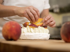 Stéphanie Labelle of Pâtisserie Rhubarbe prepares a pavlova with tarragon cream and peaches.