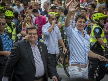 Canadian Prime Minister Justin Trudeau joins Montreal Mayor Denis Coderre as they walk in the Pride parade along Boulevard René-Lévesque in Montreal, on Sunday, August 20, 2017.