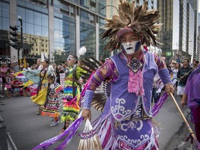 Members of Canada's Indigenous community lead the Canada Pride parade along René-Lévesque Blvd. in Montreal on Sunday, August 20, 2017.