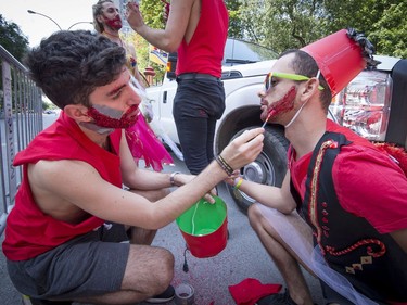 Participants prepare themselves before walking in the pride parade, along Boulevard René-Lévesque  in Montreal, on Sunday, August 20, 2017.