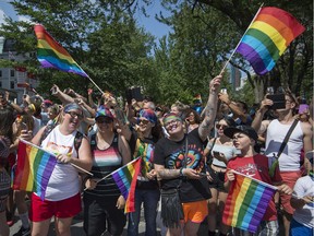 The streets were packed with onlookers dressed to enjoy the day as they watched the Pride parade along René-Lévesque Blvd. in Montreal on Aug. 20, 2017.