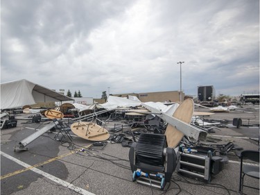 Tables and chairs remain on Tuesday, August 22, 2017 after a severe wind storm ripped apart the large tent for this year's Strangers in the Night gala, to be held at the Fairview Pointe-Claire parking lot in the West Island of Montreal.