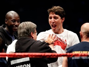 Canadian Prime Minister Justine Trudeau jokingly starts a brawl with Montreal Mayor Denis Coderre during a charity boxing match benefiting École de la relève in Montreal on Wednesday, August 23, 2017.