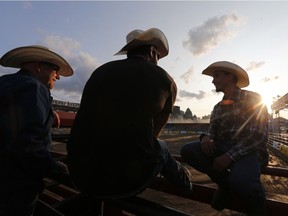 Daniel Brunelle (L), Andy Brossard (C) and Julien Besner wait for the start of the rodeo in the Old Port of Montreal, Aug. 24, 2017.