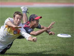 San Fransisco Flamethrowers Joel Schlachet left, and Toronto Rush Bretton Tan battle for the frisbee during the American Ultimate Disc League championship final game at the Claude Robillard Sports Complex in Montreal, on Sunday, August 27, 2017.