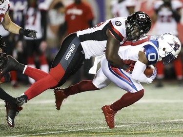 Montreal Alouettes kick returner Stefan Logan is brought down by Ottawa Redblacks player during first half of Canadian Football League game in Montreal Thursday August 31, 2017.