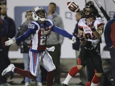 Ottawa Redblacks Greg Ellingson catches a touchdown pass behind Montreal Alouettes Tyree Hollins during second half of Canadian Football League game in Montreal, Thursday August 31, 2017.