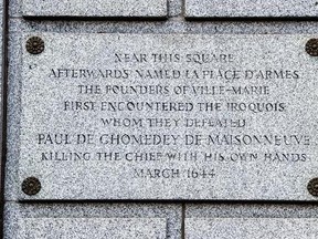 A plaque is seen on the Bank of Montreal building, Thursday, August 3, 2017 in Montreal. Michael Rice, a Mohawk man, wants the Bank of Montreal and the City of Montreal to address a plaque attached to the bank&#039;s headquarters downtown that was written in honour of Paul de Chomedey, sieur de Maisonneuve, the founder of Montreal as the plaque is historically inaccurate. THE CANADIAN PRESS/Paul Chiasson