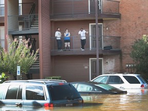 Many victims of flooding in Quebec can relate to this picture of residents in Houston waiting this week to be rescued.