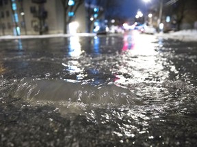 A broken water main floods a Montreal street.