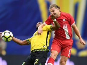 Romario Williams (left) of Jamaica and Samuel Piette of Canada clash in the first half of their CONCACAF Gold Cup quarterfinal match, July 20, 2017 at the University of Phoenix Stadium in Glendale, Arizona.