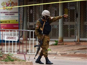 TOPSHOT-BURKINA FASO-UNREST-ATTACK

TOPSHOT - A security official gestures as he stands at a barrier close to the site of a terrorist attack in Ouagadougou on August 15, 2017. Eighteen people, including at least eight foreigners were shot dead in a Turkish restaurant in Burkina Faso, according to a provisional toll, in the latest attack in West Africa to target a spot popular with expatriates. There has been no claim of responsibility for the attack laye August 13, at the Aziz Istanbul restaurant, which is often packed with foreign nationals who go there to watch television coverage of football.  / AFP PHOTO / SIA KAMBOUSIA KAMBOU/AFP/Getty Images ORG XMIT: 883
SIA KAMBOU, AFP/Getty Images