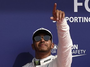 Mercedes' British driver Lewis Hamilton celebrates winning the pole after the qualifying session at the Spa-Francorchamps circuit in Spa on August 26, 2017 ahead of the Belgian Formula One Grand Prix. JOHN THYS, AFP/Getty Images