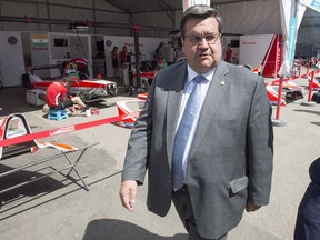 Montreal Mayor Denis Coderre walks through the paddock at the Montreal Formula ePrix electric car race in Montreal on Friday, July 28, 2017.