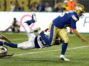 Alouettes defensive-back Dondre Wright couldn't stop Blue Bombers quarterback Matt Nichols from getting a first down on July 27, 2017, in Winnipeg.
