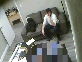 Police surveillance video of undercover RCMP officer, blurred to protect his identity, speaking to Ismaël Habib.