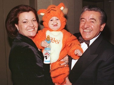 Mirella and Lino Saputo with grandson Luca out for  Halloween.