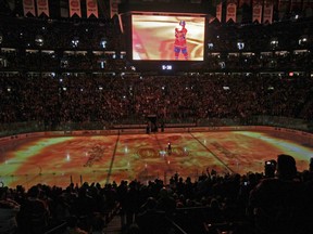 A flame graphic spreads across the ice at the Bell Centre during pre-game ceremony prior to Montreal Canadiens game 6 playoff game against the Boston Bruins in Montreal April 26, 2011.
