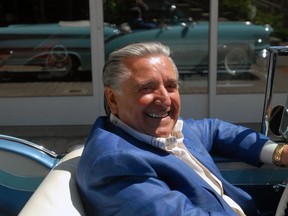 Lino Saputo in one of his many treasured collector cars, at his house in Senneville in 2010. The founder of a cheese empire retired Aug. 1, 2017.