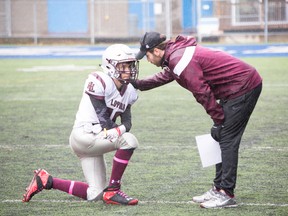 Teacher and coach John Patrick Mancini offers words of advice and encouragement to Loyola student Connor Wareham.