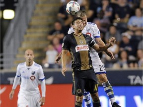 Philadelphia Union's Alejandro Bedoya heads the ball away from Montreal Impact's Samuel Piette during the first half of an MLS soccer match Saturday, Aug. 12, 2017, in Chester, Pa. The Impact won 3-0.