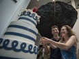 Manouane Beauchamp and Isabelle Binet-Rochette cut a cake after a quick engagement ceremony announcement in the heart of the exhibition Love Is Love: Wedding Bliss for All a la Jean Paul Gaultier at the Montreal Museum of Fine Arts in Montreal, on Saturday, Aug. 12, 2017.