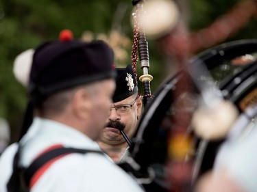 Members of the Black Watch tune up before the opening ceremonies during the Montreal Highland Games in Montreal on Sunday August 6, 2017.