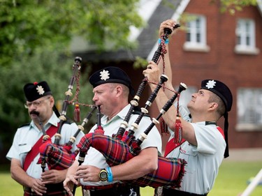 Members of the Black Watch tune up before the opening ceremonies during the Montreal Highland Games in Montreal on Sunday August 6, 2017.