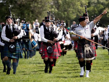 The drum major leads the bands off the field after the opening ceremonies at the Montreal Highland Games in Montreal on Sunday August 6, 2017.
