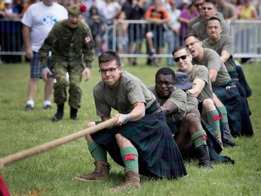 Members of the Black Watch compete in the traditional tug of war during the Montreal Highland Games in Montreal on Sunday August 6, 2017. The Black Watch beat the McGill Redmen but outnumbered the Redman 8 men to 7.