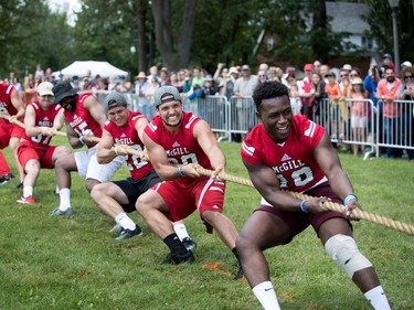 Members of the McGill Redmen football team compete in the traditional tug of war during the Montreal Highland Games in Montreal on Sunday August 6, 2017. The Black Watch beat the McGill Redmen but outnumbered the Redman 8 men to 7.