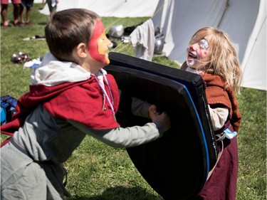 Liam Soly spares with his sister, Rafaelle, as they dress in medieval gear at the Montreal Highland Games in Montreal on Sunday August 6, 2017.