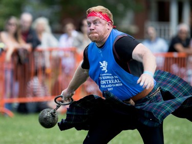 Will Barron of Maine grimaces as he releases the 28 pound weight throw during the Montreal Highland Games in Montreal on Sunday August 6, 2017.