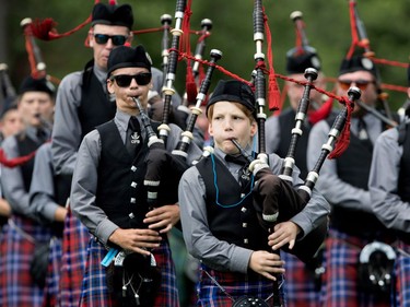 A younger piper with the Glengarry Pipe Band takes part in the Montreal Highland Games in Montreal on Sunday August 6, 2017.