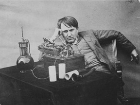 This 1888 photo provided by the Museum of Innovation and Science in Schenectady, N.Y., shows Thomas Edison listening to a wax cylinder phonograph.