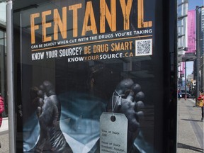 An anti-fentanyl advertisment is seen on a sidewalk in downtown Vancouver.