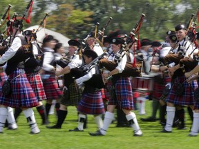 Members of the Glengarry Pipe Band from Maxville, Ont., take part in the opening ceremony of the 37th Montreal Highland Games at Arthur-Therrien Park in Verdun on Aug. 3, 2014.