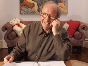 Jack Rabinovitch, founder of the Giller Awards, at his dining room table where his list is made. Behind is painting of his late wife Doris.