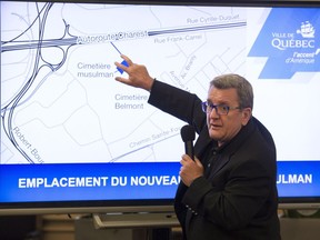 Quebec City Mayor Régis Labeaume points at a map as he announces the establishment of a Muslim cemetery in Quebec City Friday.