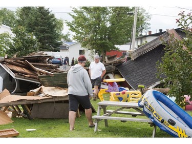 Residents survey the damage from a category one tornado, Wednesday, August 23, 2017 in Lachute, Que., northwest of Montreal.THE CANADIAN PRESS/Ryan Remiorz ORG XMIT: RYR108
Ryan Remiorz,