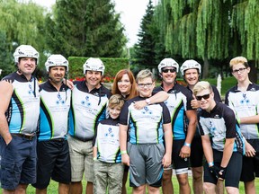 Chantale Grenon-Nyenhuis, centre, embraces two sons surrounded by Ride to Fight ALS participants. From left to right: Steve Fahey, Gary Nassibian, Scott Thornton. Chantale Grenon-Nyenhuis, sons Christophe and Nicolas, Dave Topping, Brad Topping, Matthew and Liam, Chantale's two oldest sons.  Photo credit Roxanne Goulet, ALS Society of Quebec.