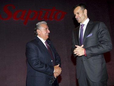 Saputo Inc. President and CEO Lino Saputo Jr., right, and Chairman Lino Saputo attend the company's annual general meeting in Laval, Que., Tuesday, August 6, 2013.