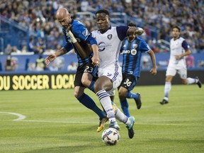 "We're at home and we want to win this game for our fans and continue to move up the table and make the playoffs," says Montreal Impact defender Laurent Ciman, battling and Orlando City SC forward Cyle Larin on Aug. 5, 2017 in Montreal.